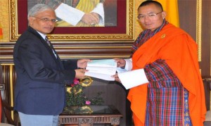 The Indian Ambassador  Haran, handed over a cheque worth Rs. 1 billion to the PM Tshering Tobgay. Photo: PM's facebook