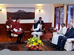 Prime Minister Manmohan Singh with King of Bhutan, Jigme Khesar Namgyel Wangchuck as Defence Minister AK Antony and External Affairs Minister Salman Khurshid looks on during a meeting in New Delhi on Tuesday